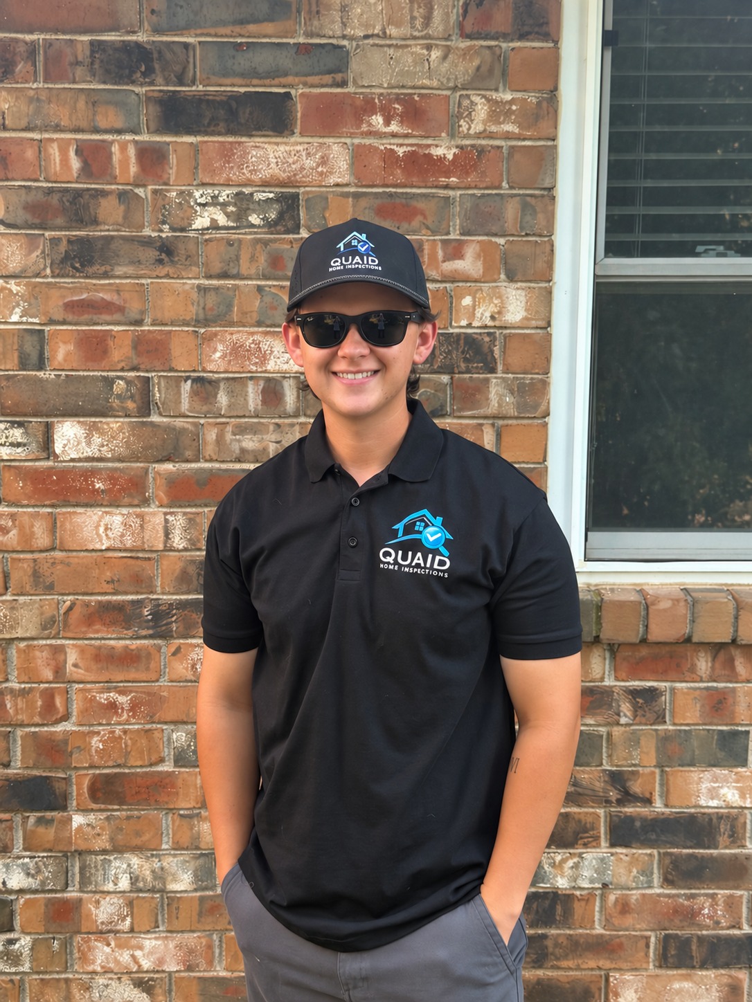 Carter Quaid wearing his Quaid Home Inspections shirt and hat